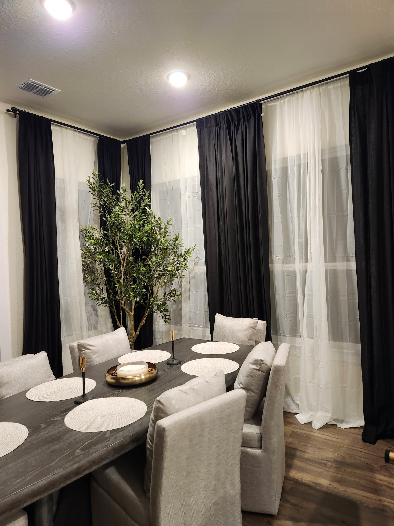 Curtains hung across a dining room window
