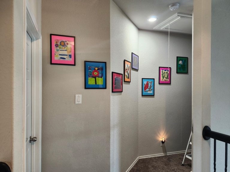 Before and after of an interior hallway with framed pictures hung